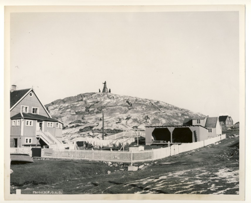 Image for RCN Photograph of Two Canadian Sailors from HMCS Swansea Looking at the Hans Egede Statue at Nuuk, Greenland, c. 1950