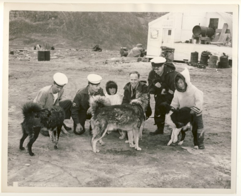 Image for RCN Photograph of Four Canadian Sailors from HMCS Swansea with Inuit Children and Dogs, c. 1950
